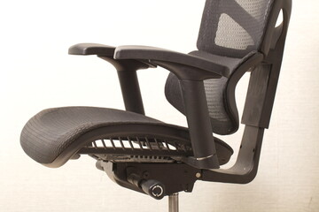 Wall Mural - office ergonomic chair with mesh coating.