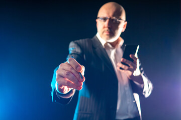 Poster - manager. a man pulls the stylus towards the camera. concept - man clicks on the screen. businessman 