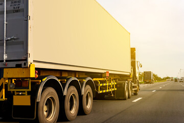 Wall Mural - Cargo Truck driving on highway road with container, transportation concept.,import,export logistic industrial Transporting Land transport on the expressway againt sunrise sky