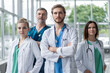 © opolja - Group of medical staff smiling at the hospital.