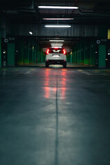 white suv car at underground parking