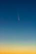 © Scott Heaney - C/2020 F3, or Comet Neowise, in the early morning sky with a gradient from orange sun glow to blue night sky.