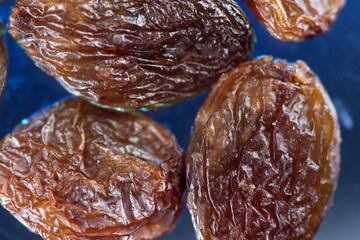 Raisins extreme closeup showing detailed texture