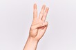 © Krakenimages.com - Close up of hand of young caucasian man over isolated background counting number 3 showing three fingers