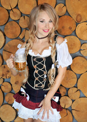 Wall Mural - Woman in dress with glass of beer. Oktoberfest concept