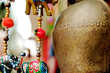 Decorative tin yak bell, beads and paper animal figures - symbols and signs of indian (hindu) and buddhist religions and tradition.