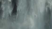 Slow motion cinematic waterfall mist Skogafoss Iceland sunny day