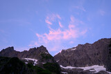 Fototapeta Perspektywa 3d - Subtle Pink Sunrise Lights up Clouds