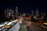 Fototapeta  - Brisbane Australia at night with traffic and skyline