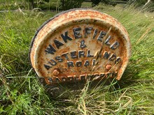 Very Old Stone Road Sign, Half Buried By The Roadside In, Saddleworth, Oldham, UK