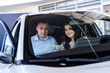 © RomanR - Happy couple sitting in new car and smiling