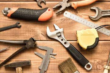 Wall Mural - Labor day. Various tools on a wooden table.