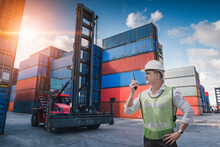 Container Logistics Shipping Management Of Transportation Industry, Transport Engineer Control Via Walkie-Talkie To Worker In Containers Shipyard. Business Cargo Ship Import/Export Factory Logistic.