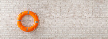 Lifebuoy Ring On Brick Wall With Space For Text