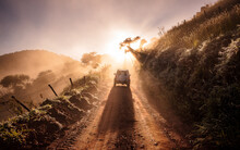 Hit The Road. Dusty Road With Sunlight. Adventure Travel Finding Breathtaking Landscapes.