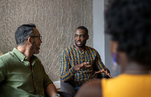 Young African Businessman Talking With Colleagues During A Meeting