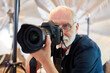 © Robert Kneschke - Professional photographer with SLR camera