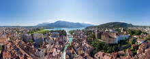 Annecy City Center Panoramic Aerial View With The Old Town, Castle, Thiou River And Mountains Surrounding The Lake, Beautiful Summer Vacation Tourism Destination In France, Europe