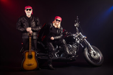 Canvas Print - Full length photo of old two cool bikers man lady sit chopper rock festival play guitar famous popular metal band meeting wear trendy rocker leather outfit isolated black color background