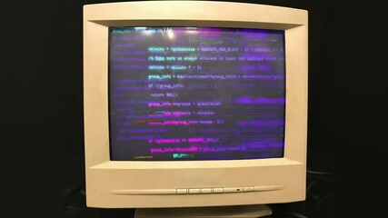 Hacking an old vintage TV or computer monitor screen 80s 90s style. Heavy Glitches on screen monitor. Abstract source code data flow. Purple and blue text. screen noise. VHS style.Old kinescope