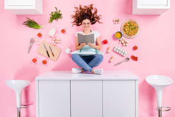 Sticker - Top above high angle full length photo positive chef girl sit table read book want decide cook evening event flat lay eggs pizza tomato knife kitchenware isolated pastel color background