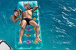 © aneduard - two boys swim in the pool on an air mattress, happy childhood, summer concept