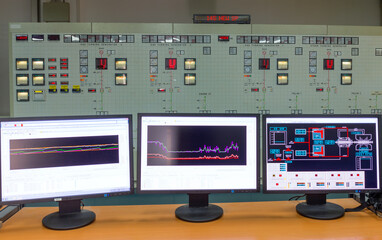 Monitors in a control room of a natural gas power plant