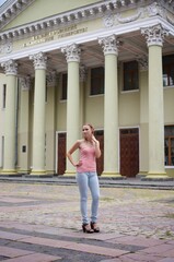 Wall Mural - The beautiful girl is walking outdoors. Girl in the park. Girl on nature. Woman outside. Positive woman smiling