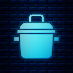 Sticker - Glowing neon Cooking pot icon isolated on brick wall background. Boil or stew food symbol. Vector.