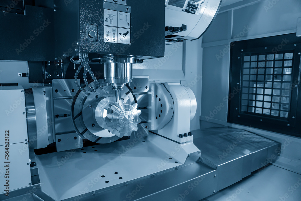The 5 axis CNC machining center cutting the mechanical parts with solid ...