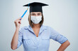 © Kalim - Student wearing protective mask isolated over white background