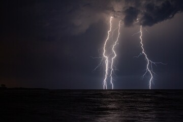 Wall Mural - beautiful scenery of lightning over the stormy sea at night
