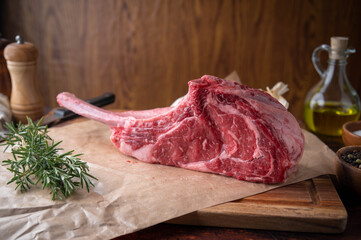 Poster - fresh tomahawk, ribeye steak meat on wooden cutting board