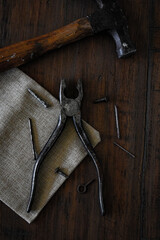 rusty tools on wooden workbench
