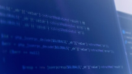 Wall Mural - computer programming code running over dark screen