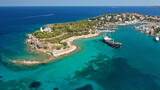 Fototapeta Uliczki - Aerial drone bird's eye view photo of picturesque neoclassic houses in historic and traditional island of Spetses with emerald clear waters, Saronic Gulf, Greece
