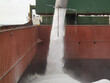 © Eugene - Loading of urea in bulk into cargo hold in progress