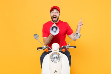 Sticker - Delivery man in red cap t-shirt uniform driving moped motorbike scooter scream megaphone isolated on yellow background studio Guy employee working courier Service quarantine pandemic covid-19 concept