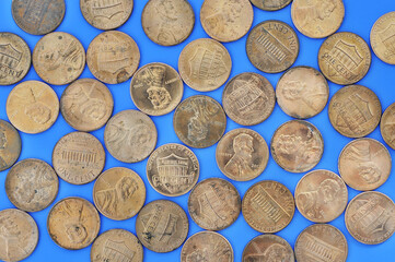 copper pennies on blue background