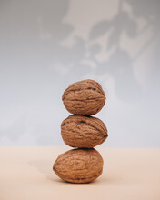 Stack Of Walnuts On Table