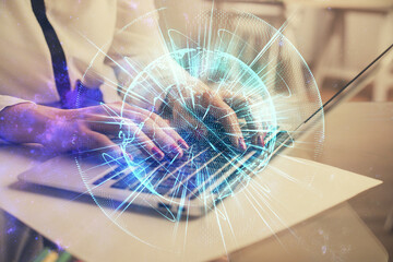 Multi exposure of woman hands typing on computer and business theme hologram drawing. Success concept.