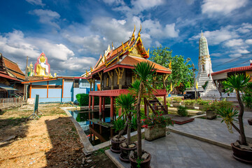 Background of a large Buddha statue in Bangkok (Wat Pak Nam Phasi Charoen), over 69 meters in height, stands majestically in the capital, a historical and cultural attraction that tourists come to see