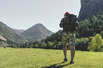 men with backpack hiking in the mountains