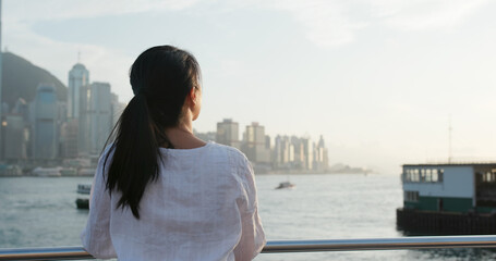 Wall Mural - Woman looks at city in Hong Kong