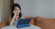 © leungchopan - Woman work on tablet computer at home