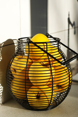 Wall Mural - Yellow golden delicious apples in wire basket