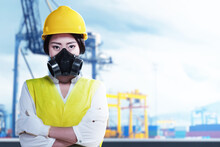 Asian Construction Worker With Hardhat And Safety Mask Standing With Crossed Arms