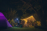 Fototapeta  - Tent in the forest, Group friends camping tent together.