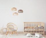 Interior of Scandinavian baby room with comfortable crib and rattan armchair in nursery decor, 3D render