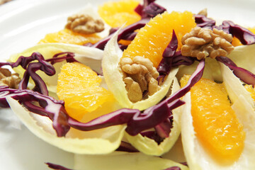 Wall Mural - Salad with endive, red cabbage and orange